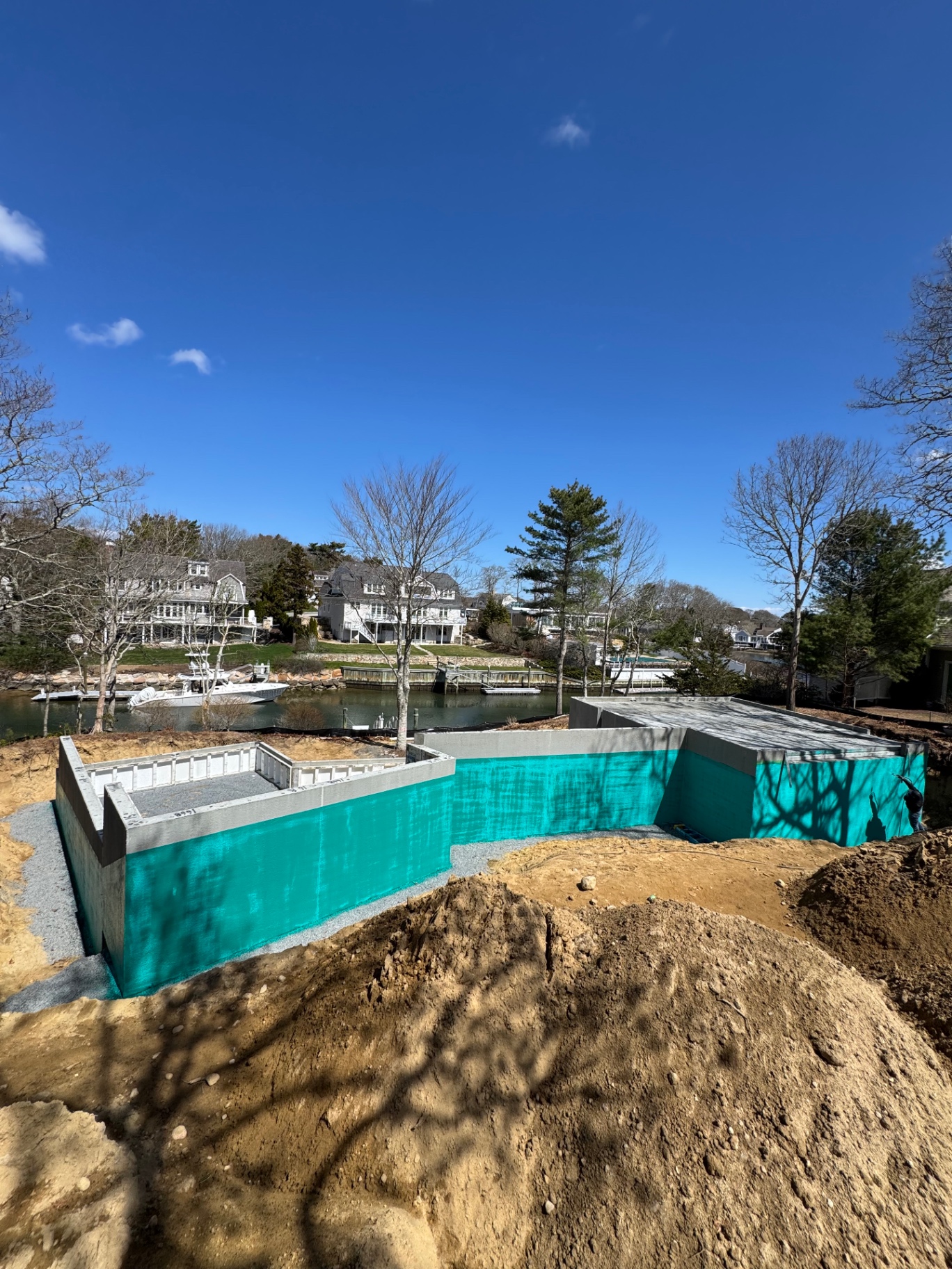 Foundation walls coated with green exterior waterproofing membrane